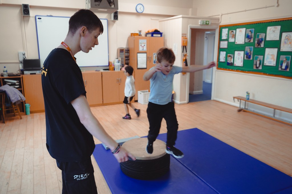 The atmosphere at Spiral Freerun, athletes and coaches in action at the Bedford gym