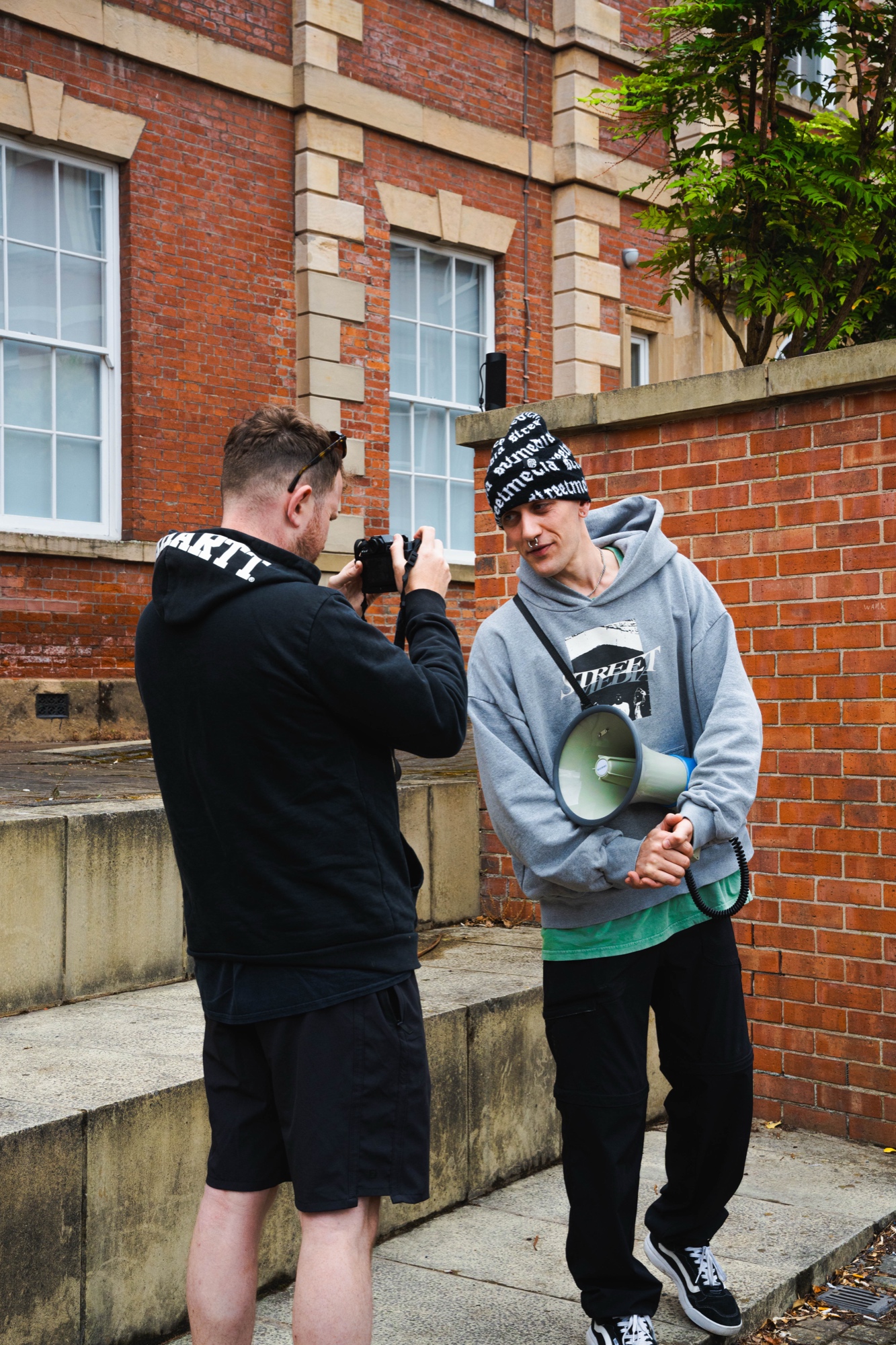 Noah Harwood rallying the crowd with a megaphone